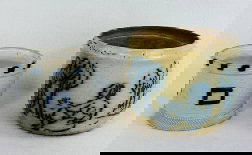 Lot 2 Blue & White Molded Stoneware Jars: Lot of two blue and white molded stoneware jars lacking their lids one of which measures approximately 3 3/4" tall in the form of a castle tower which has a white kaolin coated interior and was most l
