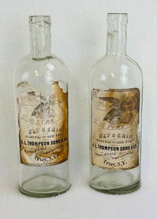 Lot 2 J L Thompson Sons & Co Glycerin Bottles w Labels: Lot of two label only clear blown in mold with tooled top bottles for John L. Thompson Sons & Co Pure Glycerin Troy New York. Condition - bottles are free of defects, labels have wear and loss as show