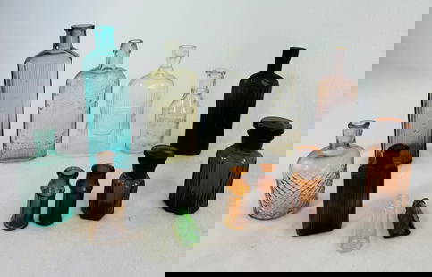 Lot 13 Assorted Poison Bottles: Lot of thirteen assorted poison bottles in clear, amber, aquamarine and green glass the largest of which measures approximately 7 1/2" tall and has a lip bruise others appear fine. Note: Most items in
