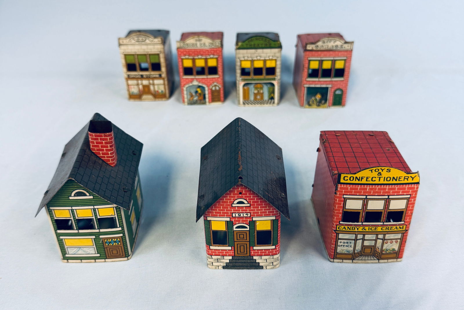 Lot 7 Lithographed Tin Building Candy Containers (1 of 6)