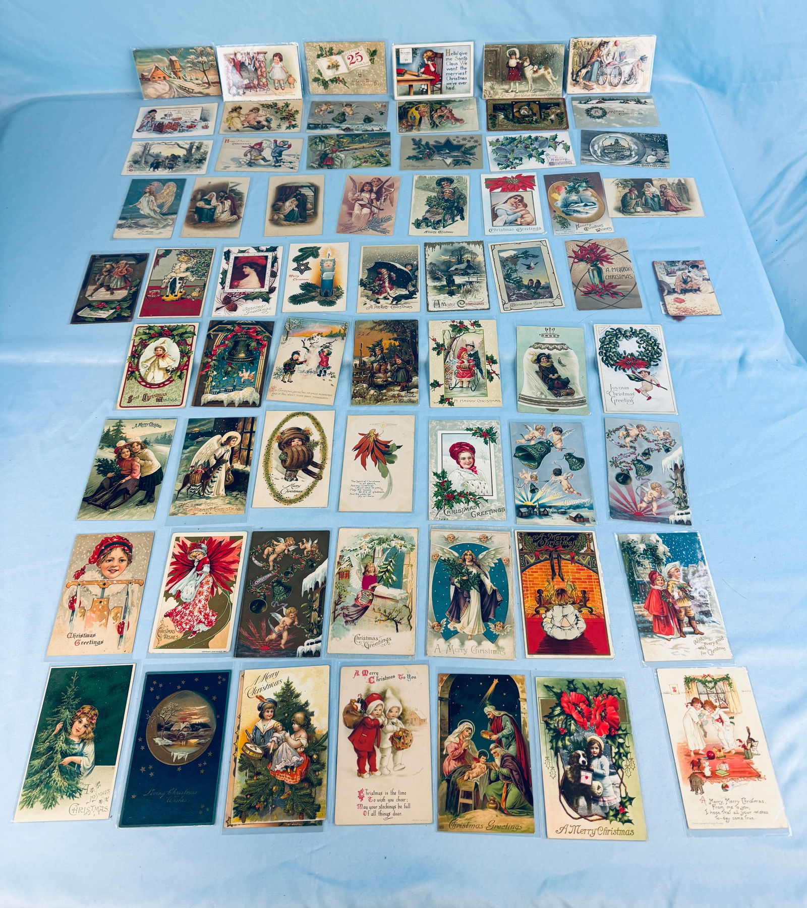 Lot 65 Early Christmas Postcards: Lot of 65 early Christmas Postcards which include depictions of Santa Claus etc. Postcards are mostly in fine condition as shown.