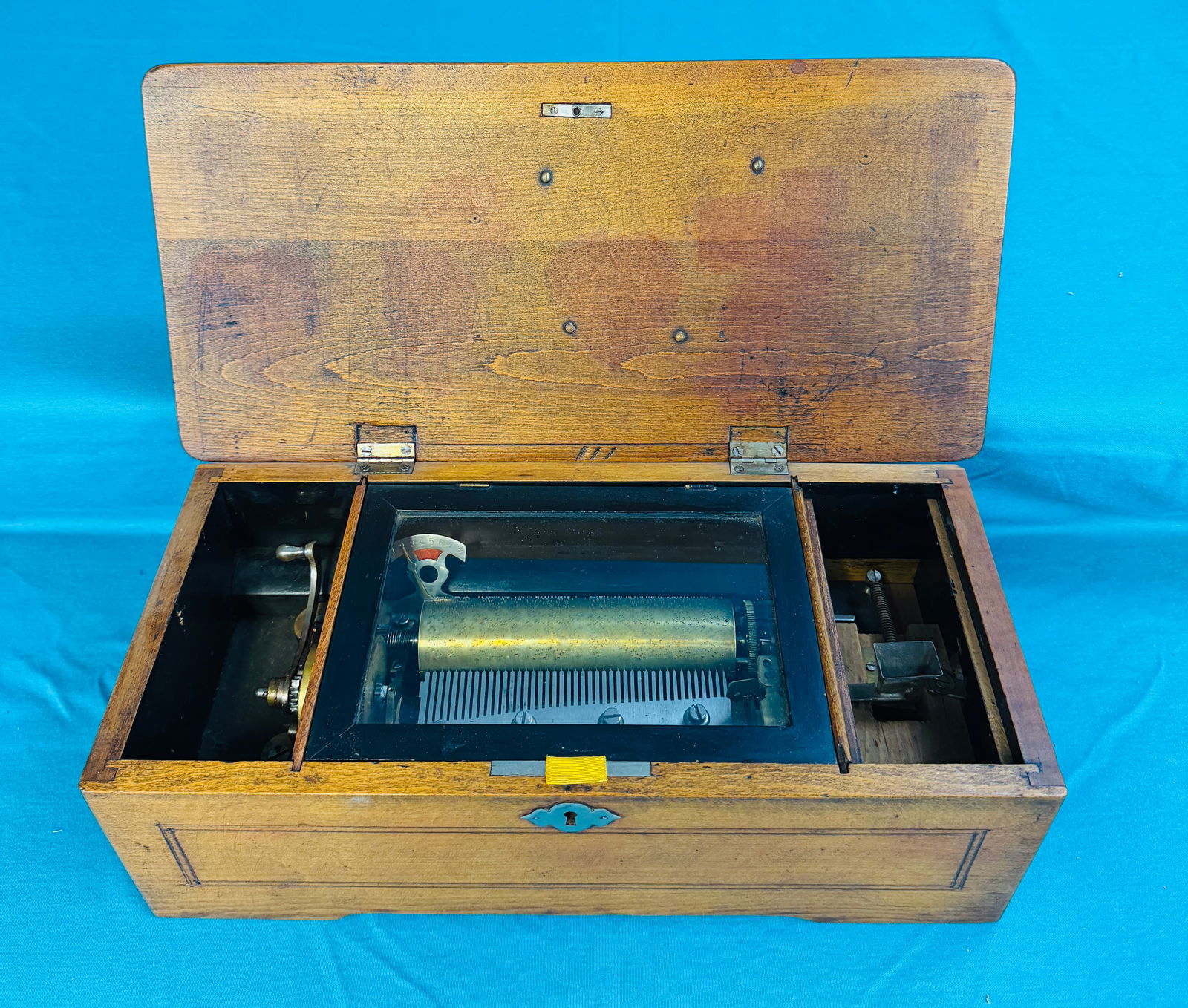 Antique Coin Operated Swiss Cylinder Music Box: Antique coin operated Swiss made cylinder music box which measures approximately 16 1/2" long by 5 1/2" tall by 7 3/4" deep with a 6" cylinder. Condition -as shown, working with no loss of comb teeth.