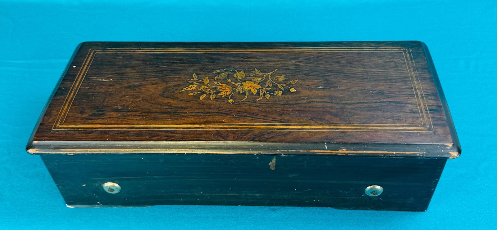 Antique Swiss Cylinder Music Box (as is): Antique rosewood cased Swiss cylinder music box with a 10 1/2" cylinder in a 20" wide, 9" deep, 6" tall case. Condition - as is with some wear to case finish, not working as governor is only partially