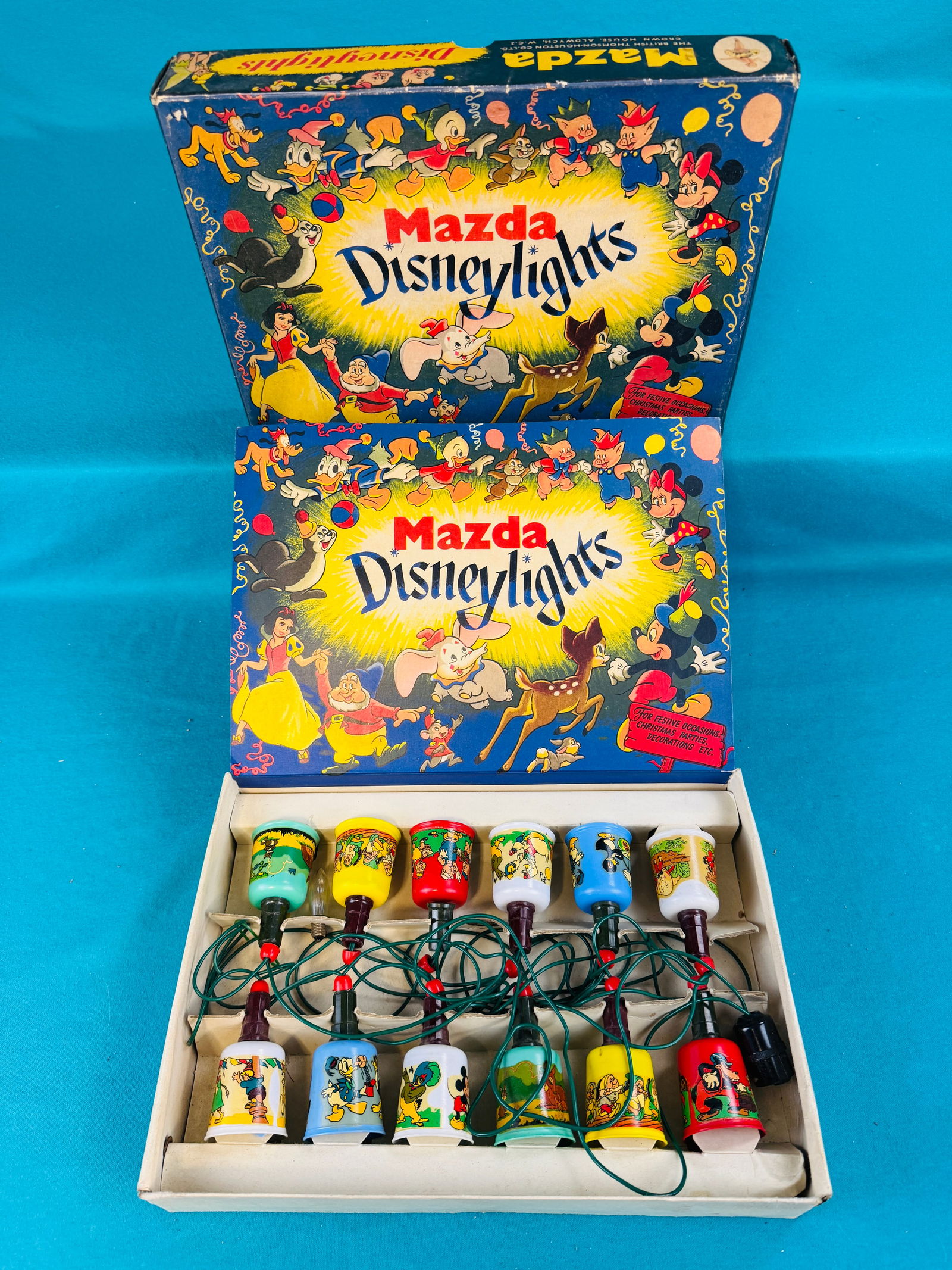 British Boxed Set Mazda Disney lights: British Thomson - Houston Co vintage boxed set of Disney lights. Figural lights are in their original colorful box. Condition - untested lights with some wear and soil to the original box but nothing