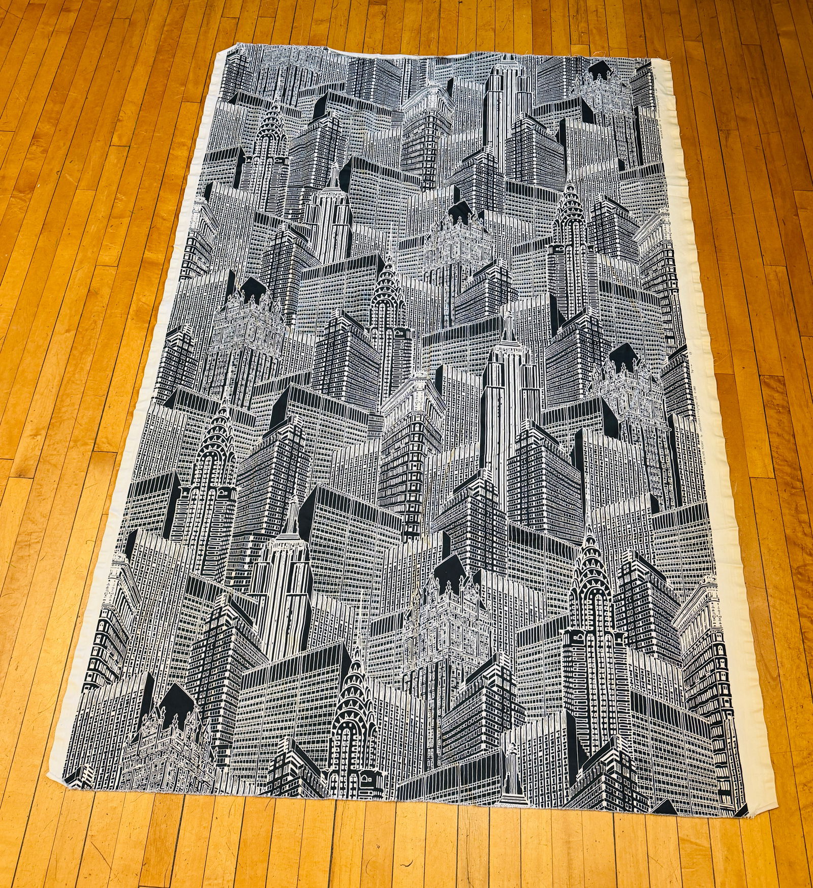 Textile Depicting All Major Buildings In NYC: 54" by 80" textile from Florence Italy, which pictures all of the major buildings in New York City. A very interesting textile which is in excellent condition as shown. NOTE: Schillaci & Shultis will