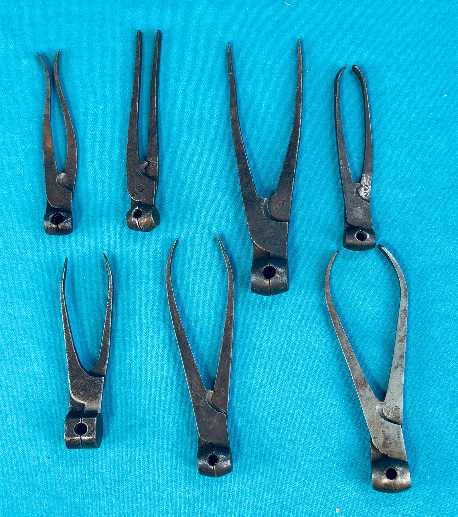 Lot 7 Antique Bullet Molds: Lot of seven antique bullet molds. Condition - is as shown. NOTE: Schillaci & Shultis will offer OUR in-house shipping services for this Lot, any quote for shipping you see in Lot Display is NOT our p