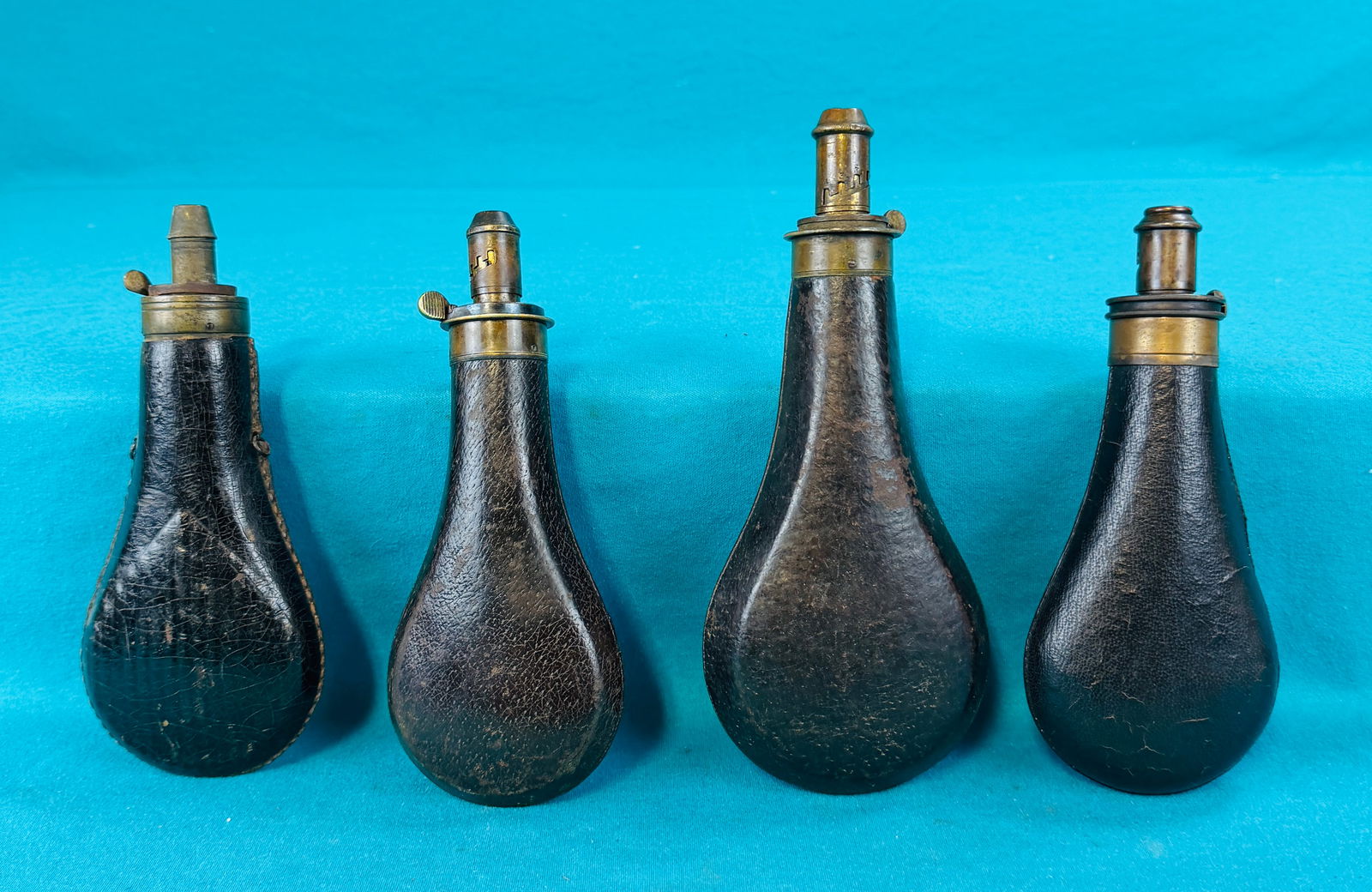 4 Antique Leather Covered Powder Flasks (1 of 7)