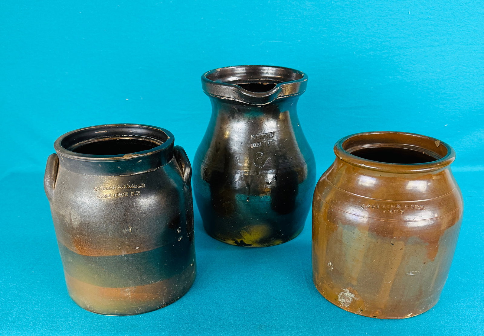 Lot:19thc Capitol Region Potter Marked Stoneware: Lot of three 19th century Capitol Region of NYS potter marked pieces of stoneware to include a light tan slip glazed one gallon straight sided jar marked I Seymour & Son Troy (2 small chips on inside 