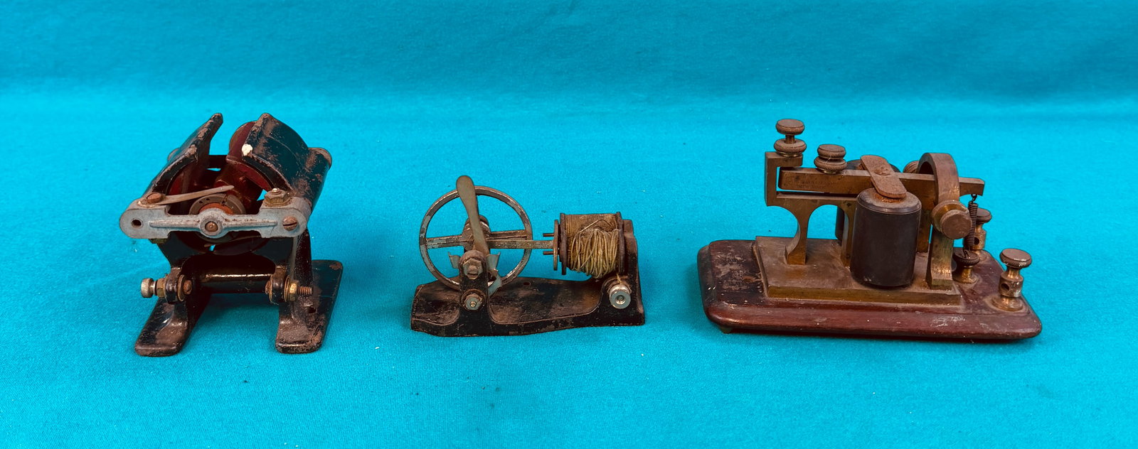 Lot 2 Early Toy Motors & Telegraph Key: Lot of two miniature toy electric motors along with a brass and walnut marked J H Bunnele & Co New York telegraph key. In house shipping available on this lot.