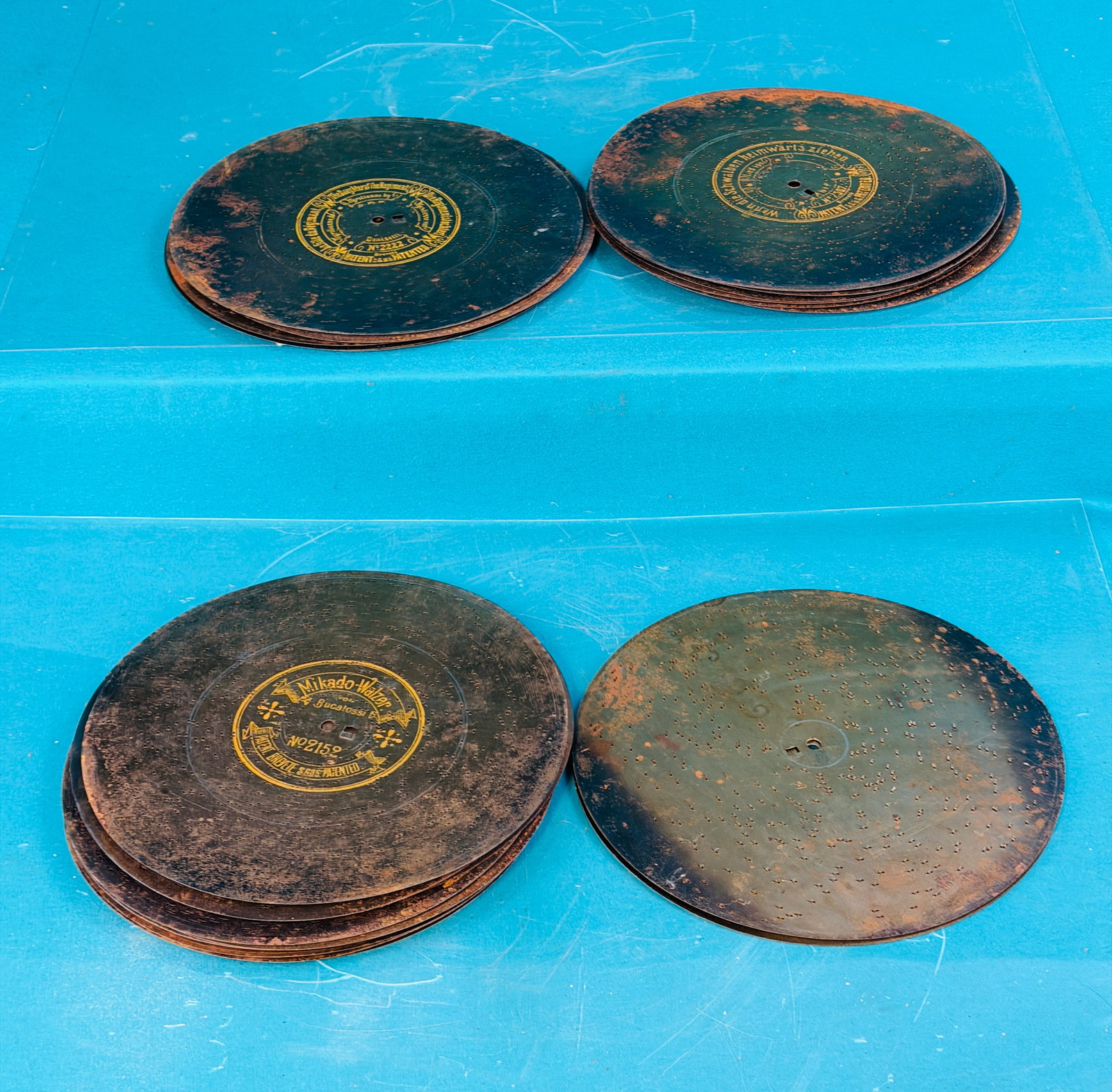 Lot 23 Metal 101/2" Music Box Disc's: Lot of 23 metal 10 1/2" diameter music box disc's. Condition - is as shown. In house shipping is available on this lot.