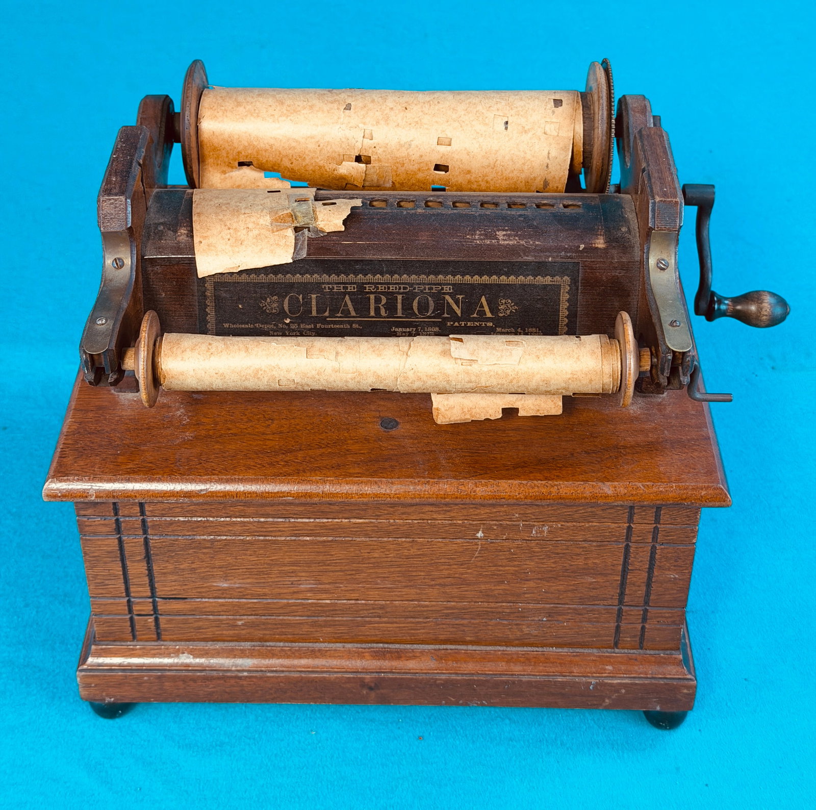 Antique The Reed Pipe Clariona Roller Organ: Antique walnut cased roller organ called the reed pipe Clariona. Condition - one small black bead foot has been lost and the bellows will need to be replaced to make functional. In house shipping avai