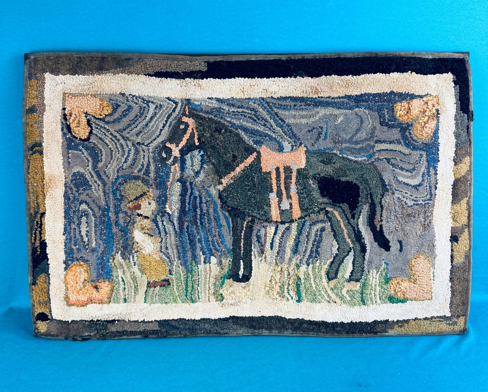 Antique Hooked Rug Cowgirl With Horse: Antique circa 1920's 37" by 24" hooked rug which features a cowgirl and her horse. Rug has been professionally mounted for display. Condition - as shown. No in house shipping available on this lot.