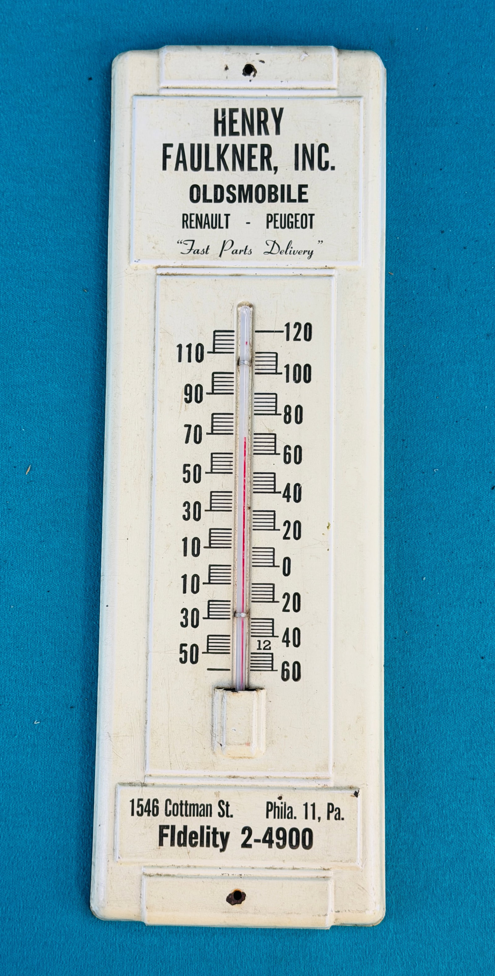 Vintage Automobile Dealership Thermometer: Vintage tin advertising thermometer for Henry Faulkner Inc Oldsmobile, Renault, Peugeot parts store located at 1546 Cottman St Philadelphia. Thermometer measures approximately 14" by 4 1/2".
