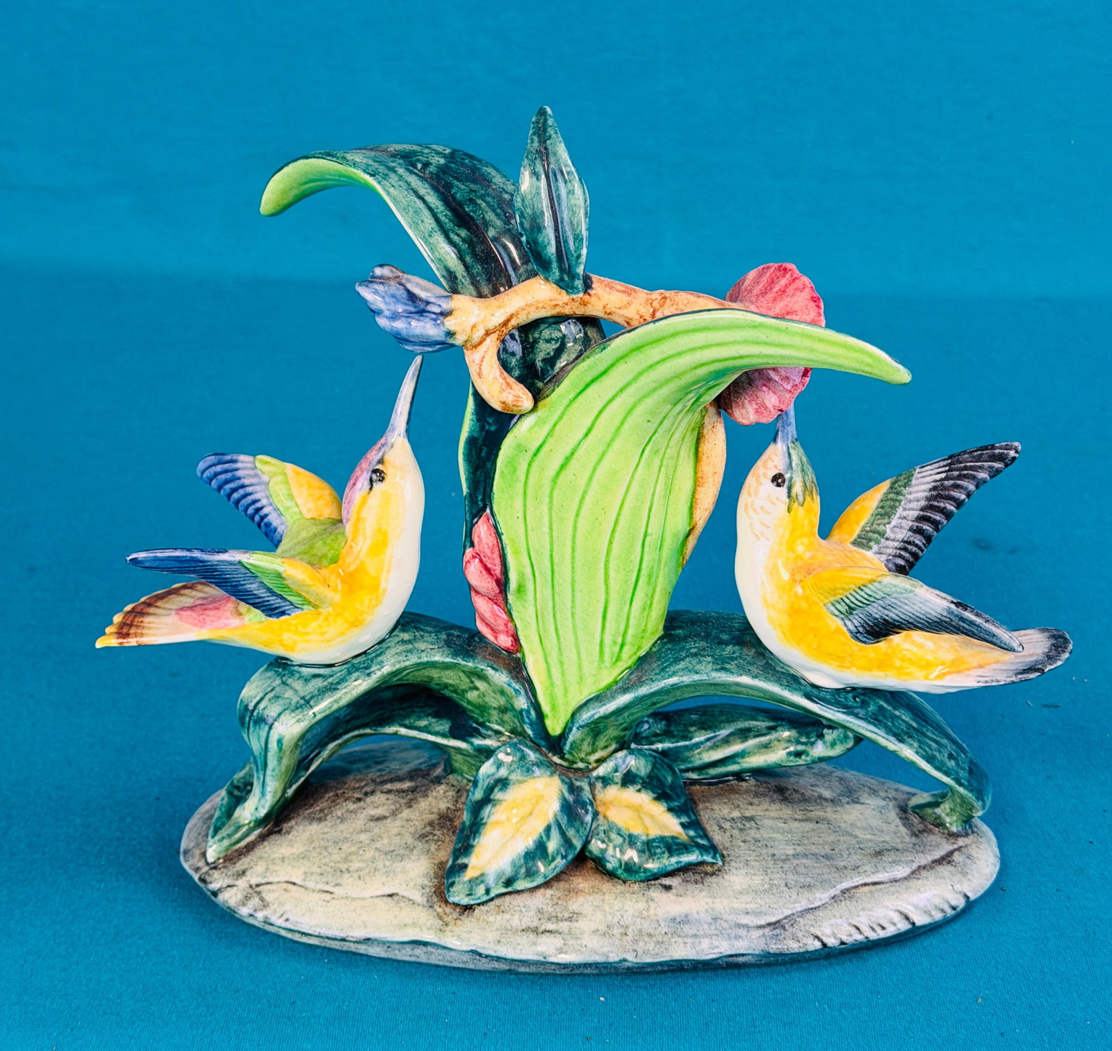 Stangl Pottery Birds Figurine #3549: Stangle Pottery Birds figurine # 3549 of double hummingbirds at flower which measures approximately 9" tall and is 9 1/2" long. Figurine is hand painted and is marked on the underside of its base. A s