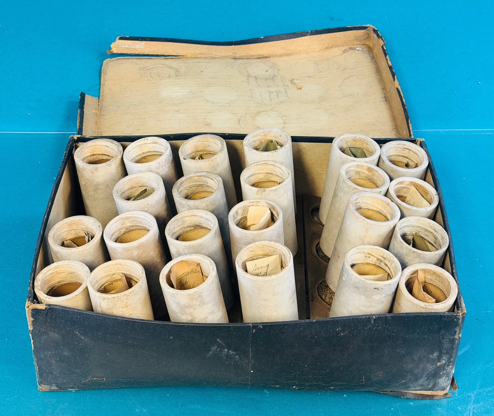 Lot Early Wax Phonograph Cylinder Records: Lot of twenty three white wax phonograph cylinder records many of which the record title is written in pencil on the slip of paper stored inside the cylinder. Condition - a couple have hairlines and t