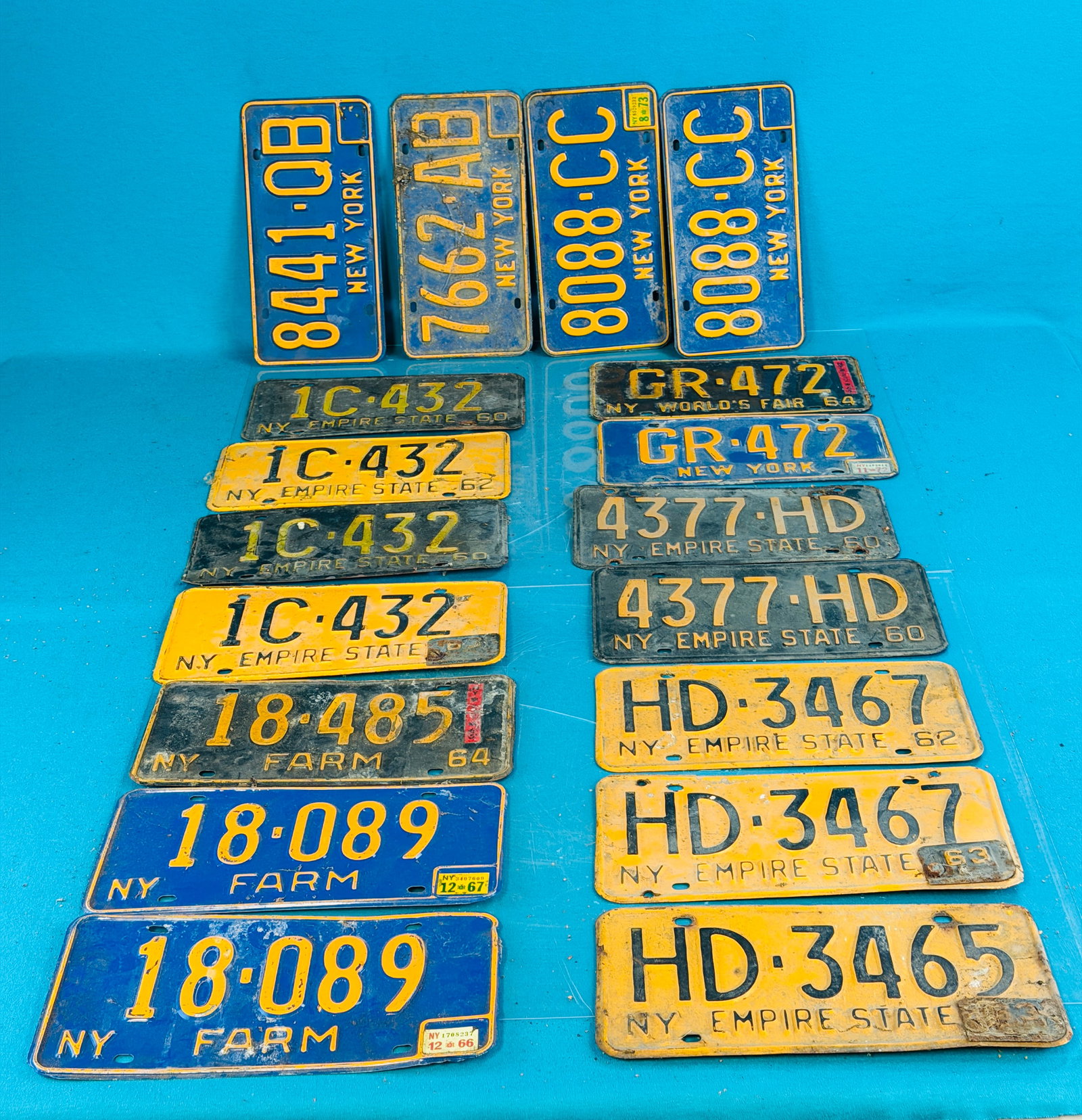Lot 18 Vintage NYS License Plates Incl Farm: Lot of eighteen New York State 1960-70's New York State license plates including three farm plates. Condition - is as shown. In house shipping is available on this lot. Approximate weight is 15 pounds