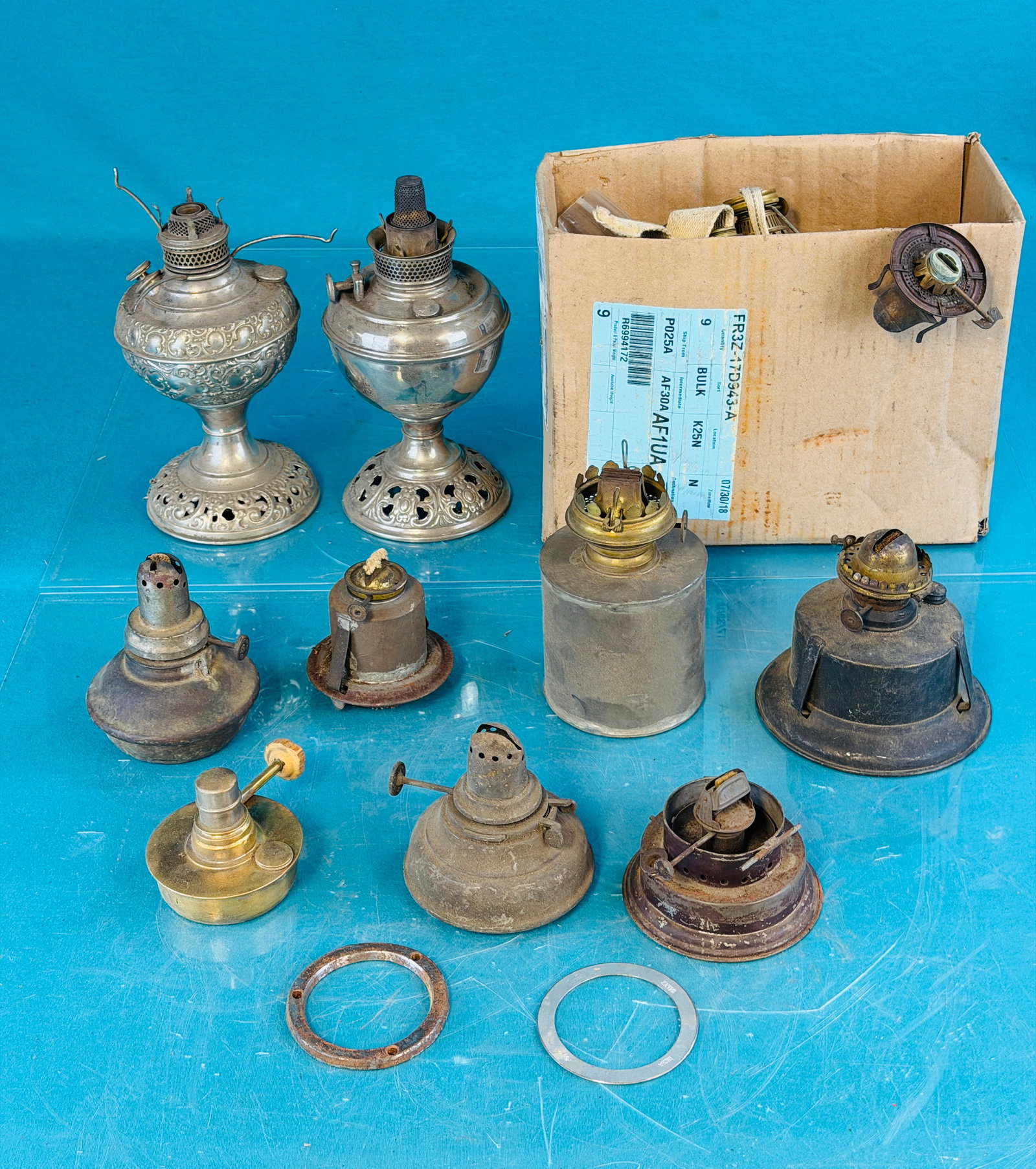 Assorted Lot Antique Kerosene Burners & Fonts: Assorted lot of antique kerosene lamps / lantern fonts and burners along with a couple lamp bases. Condition - is as shown. No in house shipping is available on this lot. Approximate weight is 10 poun
