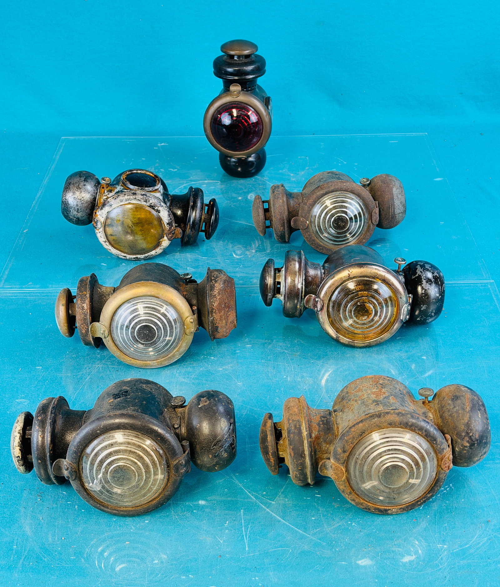 Lot 7 Model T Ford Kerosene Cowl Lights: Lot of seven original Model T Ford kerosene cowl lights / lamps. Condition - as shown in need of cleaning and restoration. No in house shipping is available for this lot. Approximate weight for this l