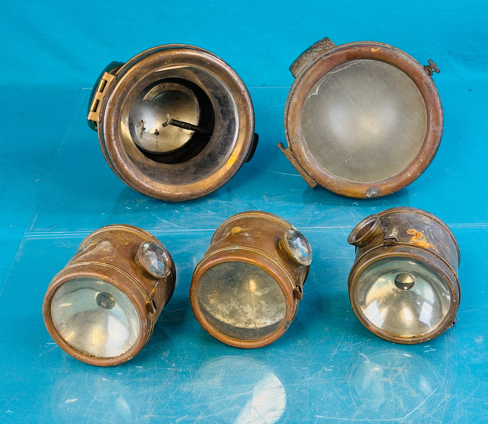 Lot 5 Antique Brass Era Automotive Lamps: Lot of five antique brass era automotive lamps which include three matching marked A W Rosen Manufacturers Of Electrical Specialties. There are also two larger lamps one marked The Cincinnati Victor C