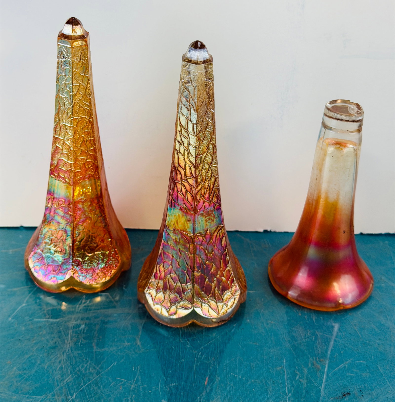 Lot 3 Antique Carnival Glass Car Vases: Lot of three antique carnival glass automobile car vases which includes a matching pair. Condition - lack brackets but pair are free of damage while the single specimen has chipping under its base. In