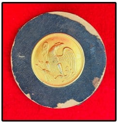 Civil War Era Tape Primer Box With Cartridge Box Eagle Insignia: Civil War era 4 1/4" diameter leather covered cardboard round box with a federal eagle cartridge box breast plate attached at front. Not really sure of its function but my best guess is it was for hol