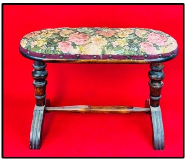 Victorian Mahogany Footstool: Victorian mahogany footstool which has been refinish and with new cloth covering on top. Footstool measures approximately 21" long and is 14 1/2" tall. Condition - fine as shown.