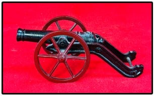 Cast Iron Miniature Cannon: Cast iron miniature cannon which measures approximately 9" long with a black and maroon painted surface. I believe this is old and has been repainted. Condition - some pitting to metal below its paint