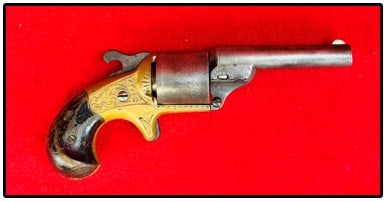 Moore Teat Fire Revolver w Factory Engraving: Moore Teat Fire Revolver with factory engraving and which is serial number 23998. Revolver does not function mechanically and there is some pitting to the metal of cylinder and barrel as shown. Revolv