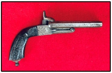 French Double Pin Fire Pistol: French double pin fire pistol with 4 3/4" barrels and being approximately 9" overall. Pistol is serial number 35. Pistol does not function mechanically and is in rough condition with pitting etc.