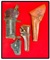Lot 3 Holsters & Rifle Scabbard: Lot of three vintage leather pistol holsters which include a large US one marked on back Bianchi / #1860 / Medium SA, another is marked Hunter on the brass buttons and the smallest marked Guardian Pol