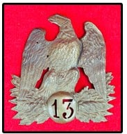 French Second Empire Shako Plate: Mid 19th century Second Empire French (1852-1870) stamped brass eagle plate for a shako which has the designation for the 13th regiment. Plate measures approximately 5" tall and is 5" wide. Condition 