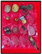 Lot Various Military Insignia Etc: Lot of various military insignia as well as some other small items which include a pair of what I believe are replica eagle stamped brass breast plates for a cartridge box sling, Williamson N.Y. firem