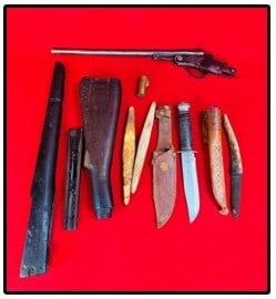 Lot Assorted Gun Parts & Sheath Knife: Lot consisting of various gun parts including a non firing mechanism for the Hamilton Rifle No 27 along with gun stock parts a couple knife sharpening stones and finally a Globemaster made in Japan