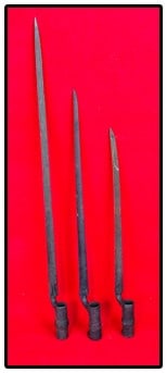 Lot 3 19th C Bayonets: Lot of three 19th century bayonets two of which are complete with their retaining rings. The longest bayonet has a 22" long triangular blade and a overall length of 25". Condition - as shown with
