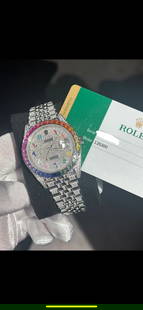 CUSTOM ROLEX DATEJUST 41 MM REF 126300 W/RAINBOW BEZEL & ARABIC RAINBOW DIA: CUSTOM ROLEX DATEJUST 41 MM REF 126300 W/RAINBOW BEZEL & ARABIC RAINBOW DIAL FULL DIAMOND WATCH (G-H, SI1-SI2) COMES WITH BOX, PAPERS & APPRAISAL #3SS10642v8