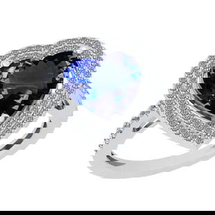 5.07 Ctw VS/SI1 Tanzanite And Diamond 18k White Gold Engagement Halo Ring: Center Stone Weight : 4.59 Ctw ( Heart Cut ) Center Stone Color : Tanzanite Stone Setting : Prong Side Diamond Weight Of Ctw 0.48 Ctw Side Stone Color : J-K Stone Clarity : VS/SI1 Stone Setting :