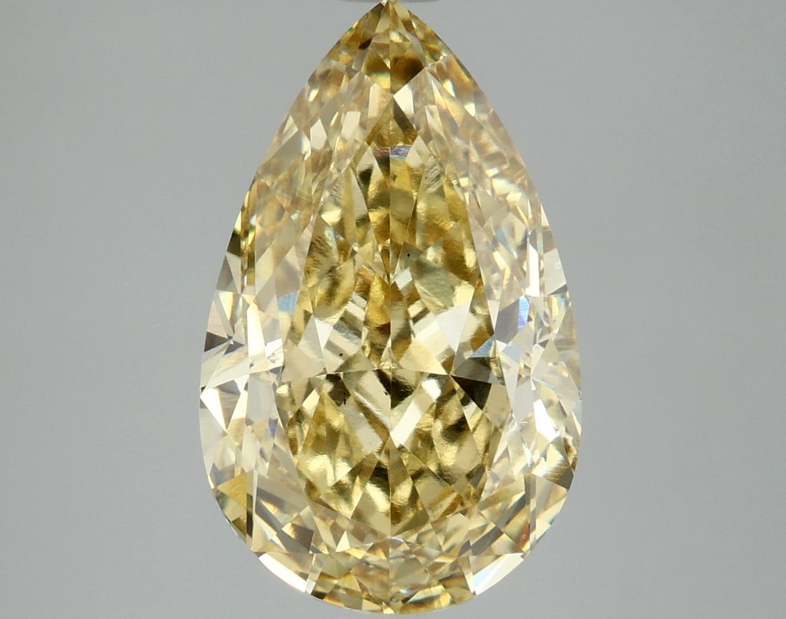4.94 ctw. VS1 IGI Certified Pear Cut Loose Diamond (LAB GROWN): IGI Certified Pe Cut Loose Diamond (LAB GROWN) - Weight :- 4.94 ctw; Color :- Fancy Intense Yellow; Clarity :-VS1 #3SS24218v15