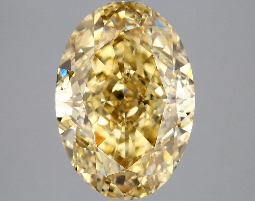 5.28 ctw. VS1 IGI Certified Oval Cut Loose Diamond (LAB GROWN): IGI Certified Ov Cut Loose Diamond (LAB GROWN) - Weight :- 5.28 ctw; Color :- Fancy Vivid Yellow; Clarity :-VS1 #3SS24244v15