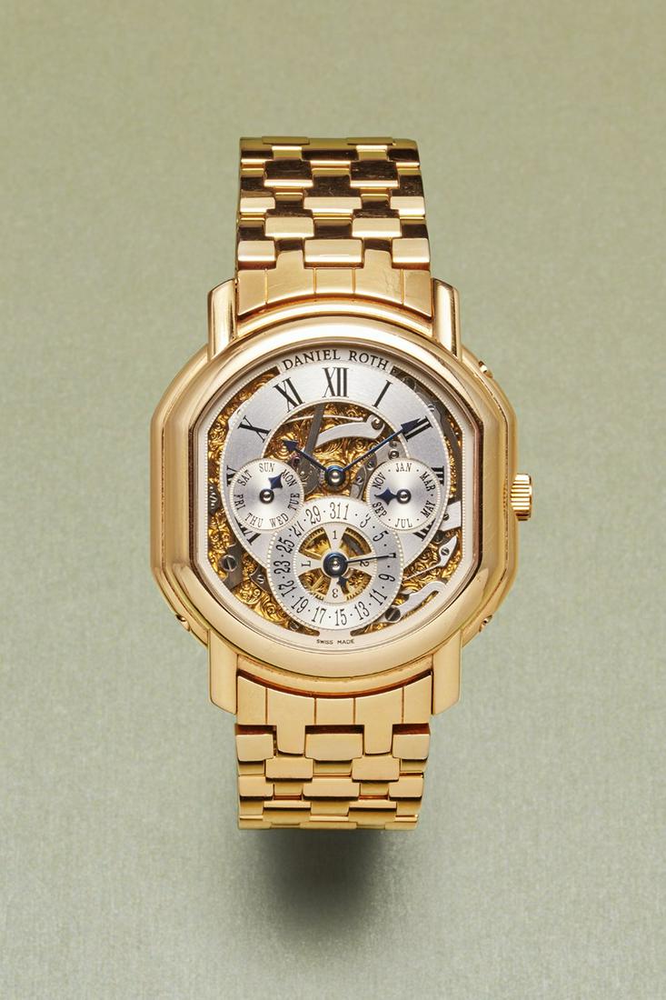 Daniel Roth Perpetual Calendar Skeleton: Case: Tonneau-shaped yellow gold case 750/1000 with yellow gold bracelet; Dial: Sceletonized silver-plated dial with roman numerals, red-gold-plated and engraved movement backplate, month indication a