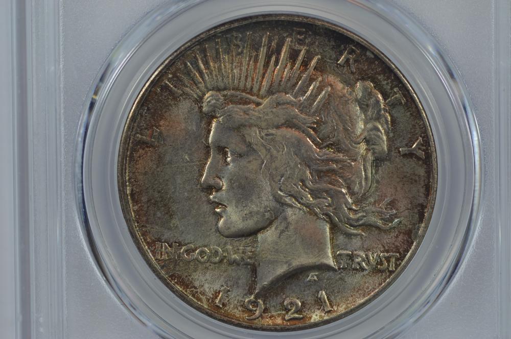$1.00 Silver 1921 Peace. PCGS MS64.: $1.00 Silver 1921 Peace. PCGS MS64. Based upon the coloration and overall countenance of the present coin and the immediately preceding lot, it is quite evident that these two examples have been toget