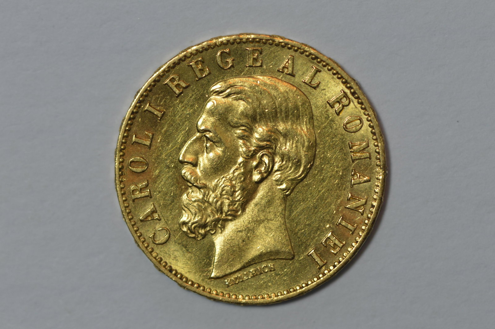 Romania 1883-B Gold 20 Lei: Romania 1883-B Gold 20 Lei (KM-20, .1867 oz AGW). Ch AU and scarce in all grades. Well struck, fully lustrous, and very close to a full Mint State designation. Est. $400.