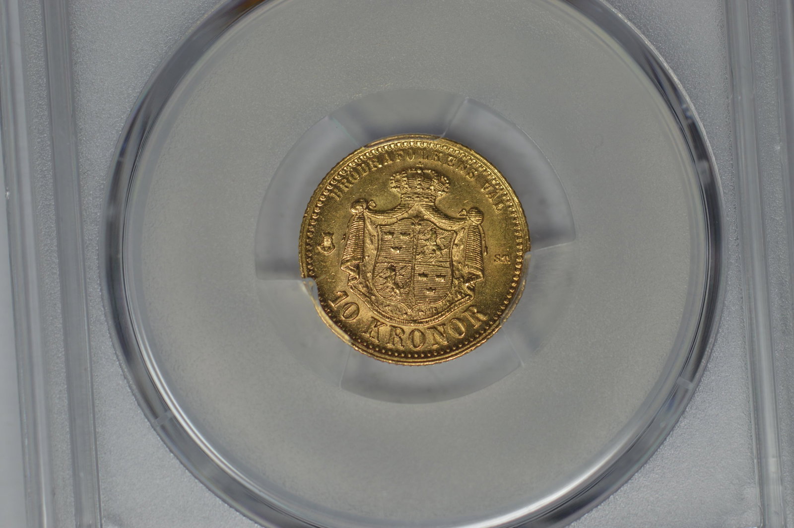 Sweden 1874-ST Gold 10 Kronor (KM-732, .1296 oz AGW). P: Sweden 1874-ST Gold 10 Kronor (KM-732, .1296 oz AGW). PCGS MS62. Frosty mint lustre augments an even strike.