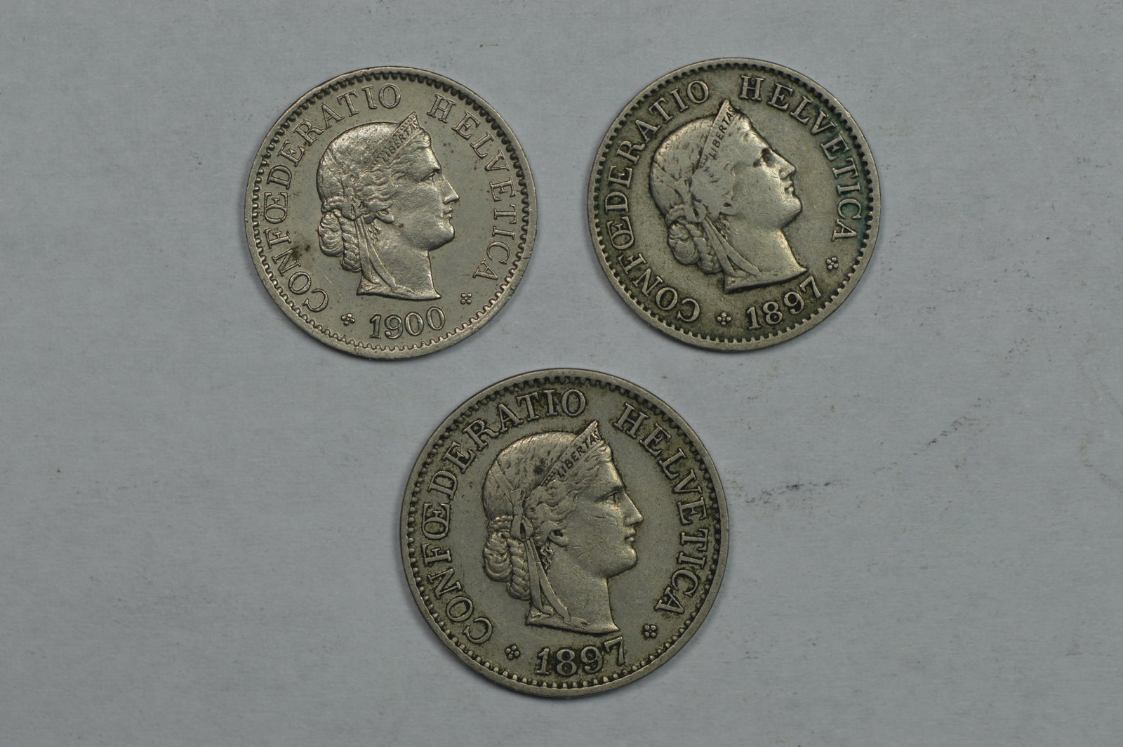 Three Better Swiss Coins as follows: 1897 Five Rappen. (1 of 2)
