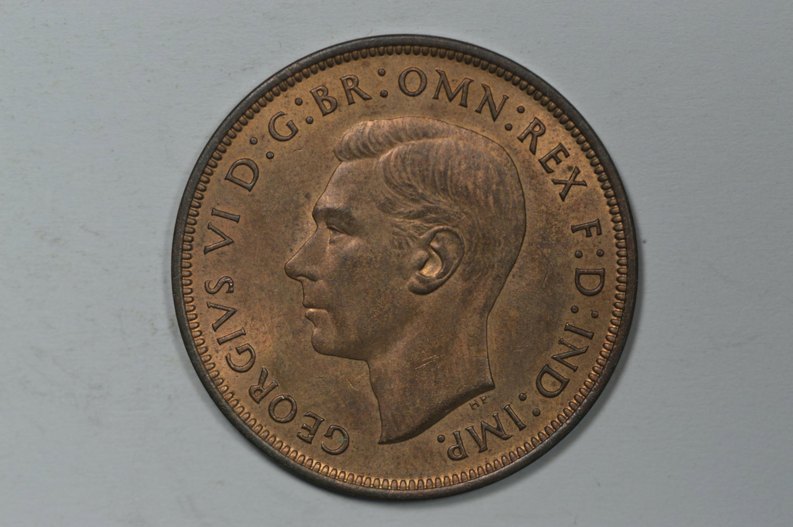 Great Britain 1938 Penny (KM-845). Ch BU or better with: Great Britain 1938 Penny (KM-845). Ch BU or better with handsome faded mint color on either side. The KM catalogue value is $15 at the MS60 grade.