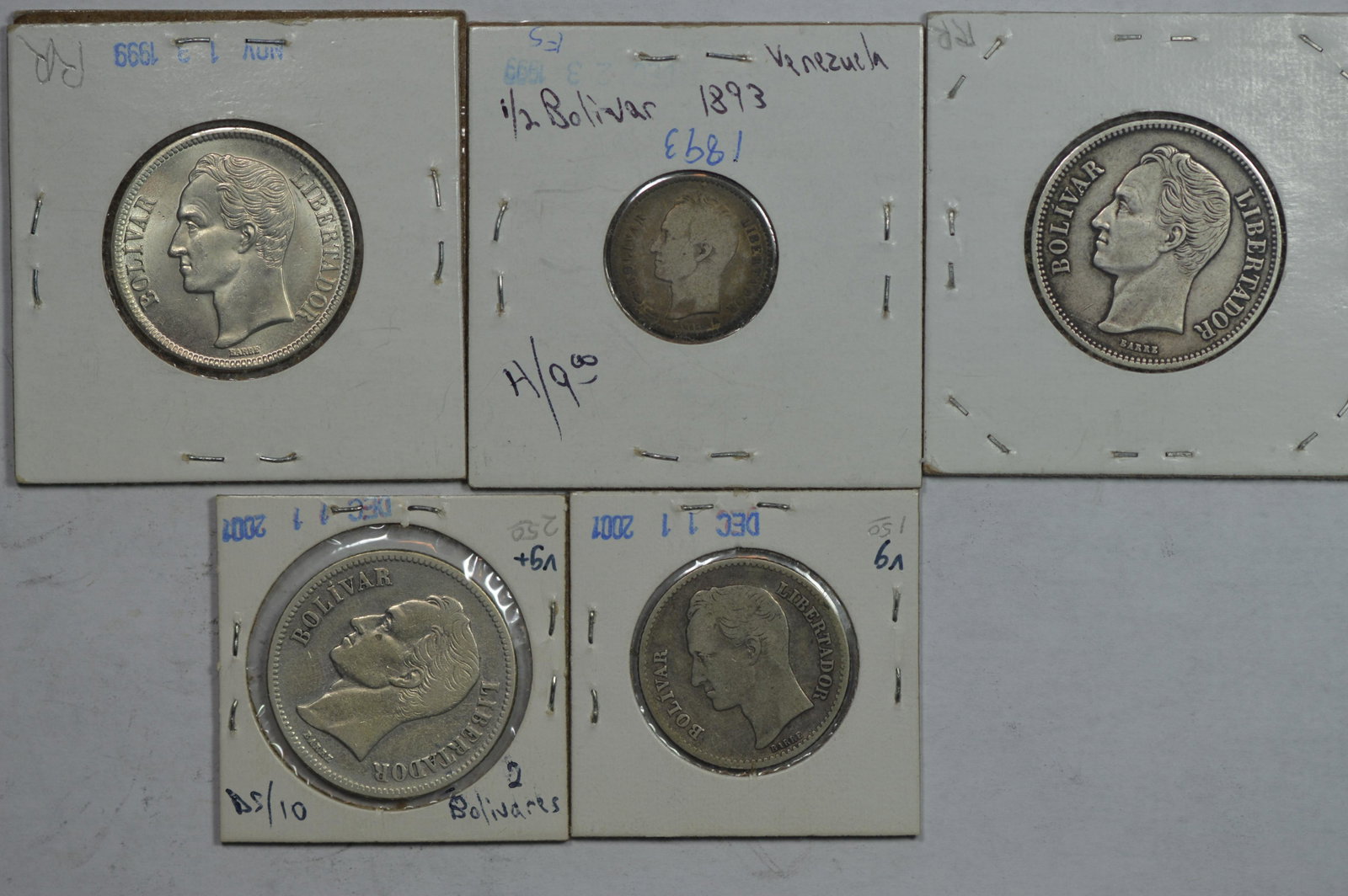 Venezuelan Silver Coinage as follows: 1/2 Bolivar 1893: Venezuelan Silver Coinage as follows: 1/2 Bolivar 1893 Good; 1 Bolivar 1919 VG; 2 Bolivares 1924 F/VF Cleaned, 1936 VF/EF, 1945 Ch BU. A total of 5 coins, the cumulative silver content of which is 1.0