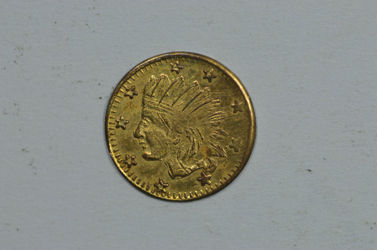 An Early California Gold "Charm" dated 1861. This examp: An Early California Gold "Charm" dated 1861. This example is the size of a fractional gold 25c piece, and clearly is not of modern origin. We are unsure of the composition, and assume that it is eithe