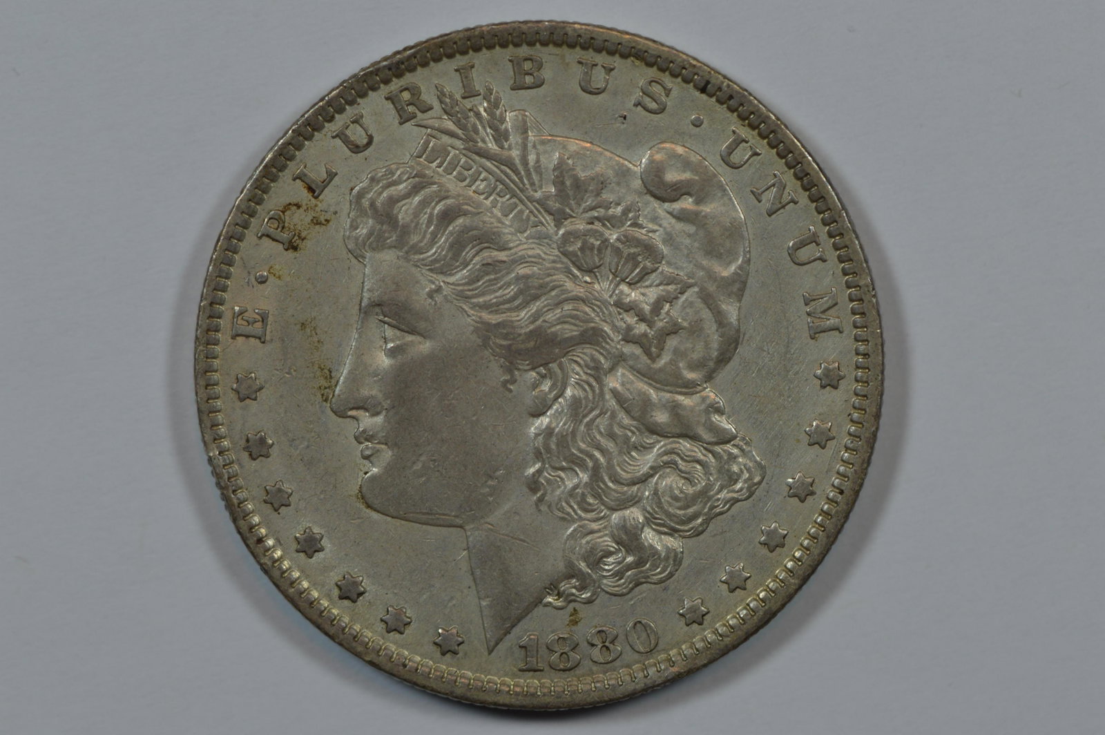 $1.00 Silver 1880-O VAM-6B (VAM-49), Ear Overdate/Hangnail Reverse: $1.00 Silver 1880-O VAM-6B (VAM-49), Ear Overdate/Hangnail Reverse. A scarce "Top 100" variety. Easily EF or better with claims to a higher grade. Est. $50.