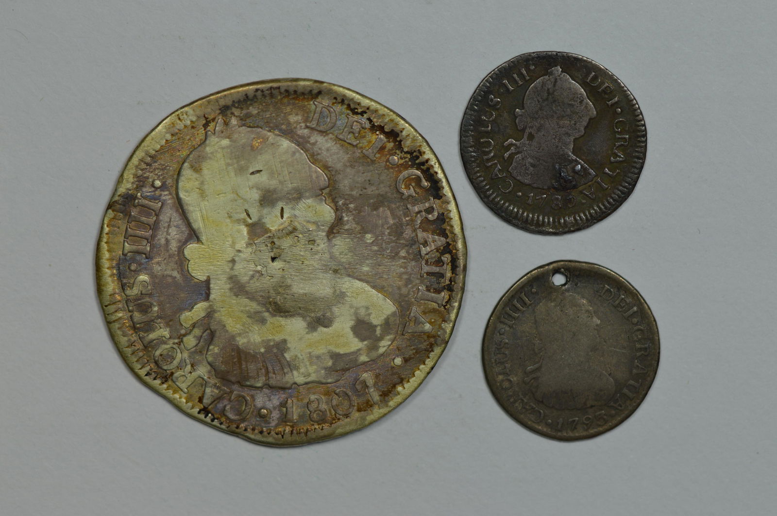 A Trio of Lesser Quality Spanish Colonial Silver Coins minted at Santiago. (1 of 2)