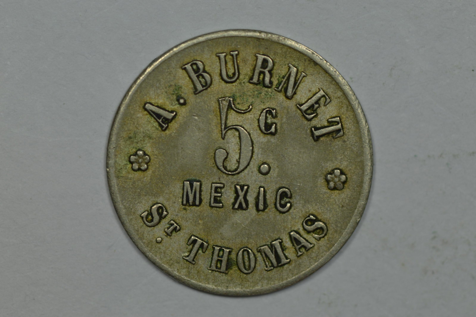 Danish West Indies. A. Burnet (circa 1887, copper-nickel, 1.6 grams) 5 Cent Token.: Danish West Indies. A. Burnet (circa 1887, copper-nickel, 1.6 grams) 5 Cent Token. Abt. EF and scarce. Burnet was a prominent innkeeper on the island of St. Thomas. Est. $60.