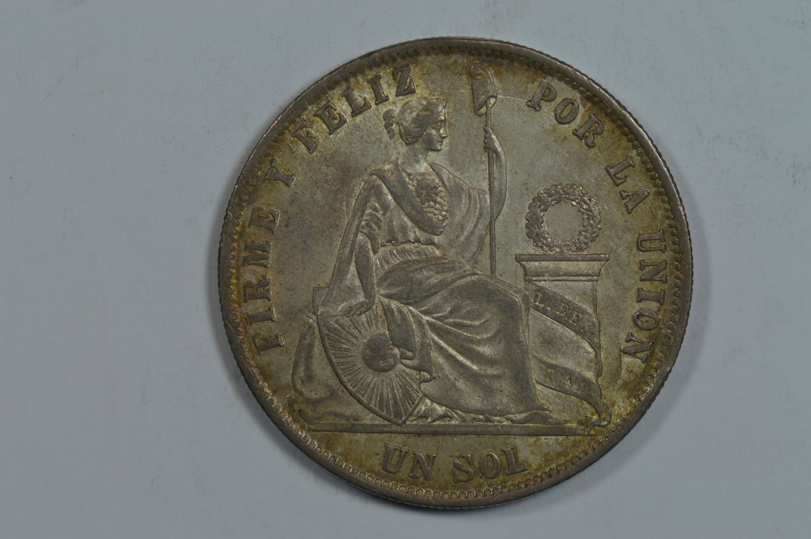 Peru 1871 YJ Silver Sol (KM-196.3, .7234 oz ASW).: Peru 1871 YJ Silver Sol (KM-196.3, .7234 oz ASW). The reverse legend is notably doubled, especially so at the 'Y' in YJ. BU and with pleasant, delicate russet-golden toning. An ever so minor obverse r